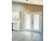 Bright kitchen area featuring white cabinets and a modern pendant light at 2618 S 81St Ln, Phoenix, AZ 85043