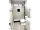 Shower with glass door and black and white accent tile at 2618 S 81St Ln, Phoenix, AZ 85043