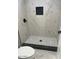 Shower with black and white tile and dark shower fixtures at 2618 S 81St Ln, Phoenix, AZ 85043
