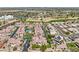 Extensive aerial view showcasing condos with a swimming pool, well maintained grounds, and palm trees at 2801 N Litchfield Rd # 37, Goodyear, AZ 85395