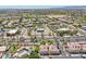An elevated view displaying condos with palm trees and local commercial properties, offering convenience at 2801 N Litchfield Rd # 37, Goodyear, AZ 85395
