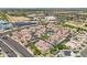 Stunning aerial view of the condos, palm trees, and neighboring commercial areas at 2801 N Litchfield Rd # 37, Goodyear, AZ 85395