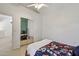 Bedroom with neutral carpeting, sliding mirror closet doors, and a ceiling fan for added comfort at 2801 N Litchfield Rd # 37, Goodyear, AZ 85395