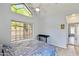 Bedroom with tile flooring, vaulted ceiling, and large windows offering plenty of natural light at 2801 N Litchfield Rd # 37, Goodyear, AZ 85395