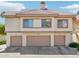 Exterior of a multi-story building with garages and desert landscaping at 2801 N Litchfield Rd # 37, Goodyear, AZ 85395