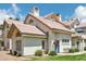 Charming home with a red tile roof, manicured lawn, and inviting blue front door at 2801 N Litchfield Rd # 37, Goodyear, AZ 85395