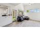 Bright, open-concept living area with a plush leather couch and lots of natural light at 2801 N Litchfield Rd # 37, Goodyear, AZ 85395