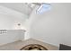 Loft space with carpeted flooring, a vaulted ceiling, and a unique window at 2801 N Litchfield Rd # 37, Goodyear, AZ 85395