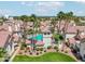 Beautiful community pool area surrounded by lush landscaping and palm trees in a charming residential neighborhood at 2801 N Litchfield Rd # 37, Goodyear, AZ 85395