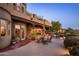 Spacious patio with a dining area, built-in grill, lush landscaping, and pool views at 29412 N 108Th Pl, Scottsdale, AZ 85262