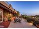 Stylish backyard patio with comfortable seating and desert views, perfect for entertaining at 29412 N 108Th Pl, Scottsdale, AZ 85262