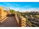 Scenic view from a balcony showcasing desert landscaping and distant mountain vistas at 29412 N 108Th Pl, Scottsdale, AZ 85262