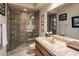 A lovely bathroom featuring a tiled glass shower and tiled countertops at 29412 N 108Th Pl, Scottsdale, AZ 85262