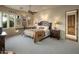 Bedroom with neutral paint, carpet flooring, ceiling fan, and view to the outdoors at 29412 N 108Th Pl, Scottsdale, AZ 85262