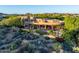 Desert home with a covered patio and mature landscaping, creating a private and serene outdoor oasis at 29412 N 108Th Pl, Scottsdale, AZ 85262
