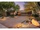 Desert landscaping highlights this beautiful property, marked with an illuminated address stone at 29412 N 108Th Pl, Scottsdale, AZ 85262