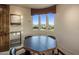 Bright game room featuring a game table with views from the adjacent windows at 29412 N 108Th Pl, Scottsdale, AZ 85262