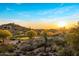 A beautiful view of a desert golf course, homes, and a colorful sunset at 29412 N 108Th Pl, Scottsdale, AZ 85262