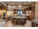 A gourmet kitchen with wood cabinets, large center island, and stainless steel appliances at 29412 N 108Th Pl, Scottsdale, AZ 85262