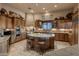 Gourmet kitchen with wood cabinets, center island and stone countertops at 29412 N 108Th Pl, Scottsdale, AZ 85262
