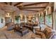 Spacious living room featuring wood beam ceilings and comfortable seating at 29412 N 108Th Pl, Scottsdale, AZ 85262