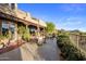 Beautiful outdoor patio with dining sets and lush landscaping with mountain views at 29412 N 108Th Pl, Scottsdale, AZ 85262