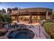 Outdoor pool and patio, featuring a serene setting and seamless transition to indoor living at 29412 N 108Th Pl, Scottsdale, AZ 85262