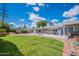 The well-maintained backyard features a lush lawn, patio, and in-ground pool, perfect for outdoor enjoyment and relaxation at 3109 N 81St St, Scottsdale, AZ 85251