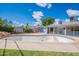 Lush backyard featuring a sparkling pool with diving board and grassy area perfect for outdoor enjoyment at 3109 N 81St St, Scottsdale, AZ 85251