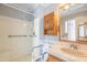 Updated bathroom featuring tiled vanity, accessible walk-in shower with safety bars and overhead lighting at 3109 N 81St St, Scottsdale, AZ 85251