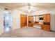 Bedroom with a ceiling fan, carpeted floor, television, doorway, and built-in wood headboard at 3109 N 81St St, Scottsdale, AZ 85251
