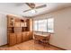 Dining area features hardwood floors, built-in hutch, and a large window at 3109 N 81St St, Scottsdale, AZ 85251