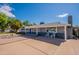 Inviting single-story home with a driveway, desert landscaping, and a cozy front porch at 3109 N 81St St, Scottsdale, AZ 85251