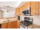 Close-up of kitchen showcasing granite countertops and stainless steel appliances at 3109 N 81St St, Scottsdale, AZ 85251