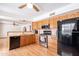 Well-lit kitchen boasts stainless steel appliances, granite counters, and wooden cabinets at 3109 N 81St St, Scottsdale, AZ 85251