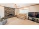 Spacious living room with a comfortable couch, entertainment center, and ample natural light at 3109 N 81St St, Scottsdale, AZ 85251