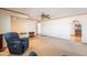 Open living room with a ceiling fan, carpet and wood flooring, and easy access to other living spaces at 3109 N 81St St, Scottsdale, AZ 85251