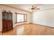 Inviting living room with hardwood floors, large window, and built-in storage cabinet at 3109 N 81St St, Scottsdale, AZ 85251
