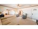 Spacious living room with carpet, ceiling fan, archways, and neutral color palette at 3109 N 81St St, Scottsdale, AZ 85251
