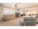 Bright living room with an open layout, plush carpeting, and a clear view into adjacent spaces at 3109 N 81St St, Scottsdale, AZ 85251