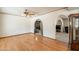 Open concept living room featuring hardwood floors and archways at 3109 N 81St St, Scottsdale, AZ 85251