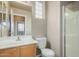 Bathroom featuring a sink, toilet, and shower with glass block window and door at 3706 E Yeager Dr, Gilbert, AZ 85295