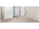 Carpeted bedroom showcasing open closet doors and neutral wall paint throughout at 3706 E Yeager Dr, Gilbert, AZ 85295