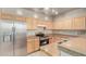 Functional kitchen with stainless steel appliances, ample counter space, and neutral cabinets at 3706 E Yeager Dr, Gilbert, AZ 85295
