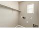 Laundry room featuring shelving, a window, and hookups for the washer and dryer at 3706 E Yeager Dr, Gilbert, AZ 85295