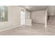 Inviting living room featuring tile flooring, neutral walls, staircase, and natural light at 3706 E Yeager Dr, Gilbert, AZ 85295