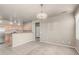 Open living area with carpet flooring, neutral walls, and adjacent kitchen at 3706 E Yeager Dr, Gilbert, AZ 85295