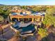 Aerial view of a luxurious home with a private pool, patio, and stunning desert surroundings at 39810 N 105Th Way # 128, Scottsdale, AZ 85262