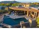 Aerial view of backyard with pool, patio and comfortable seating, perfect for outdoor living at 39810 N 105Th Way # 128, Scottsdale, AZ 85262