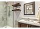 Modern bathroom with glass shower, floating shelves, and granite vanity at 39810 N 105Th Way # 128, Scottsdale, AZ 85262